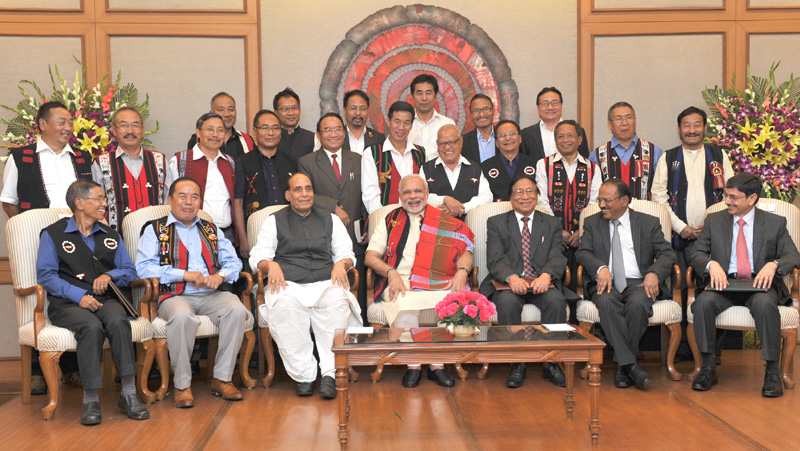 Indian Prime Minister Narendra Modi in a group photo at the signing ceremony of historic peace accord between Government of India & NSCN, in New Delhi on August 03, 2015. Home Minister Rajnath Singh is also seen.